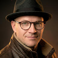 Headshot of Adam J. Spencer.