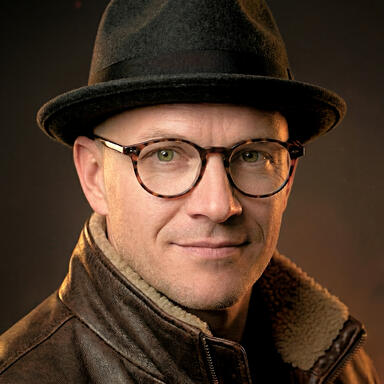 Headshot of Adam J. Spencer.